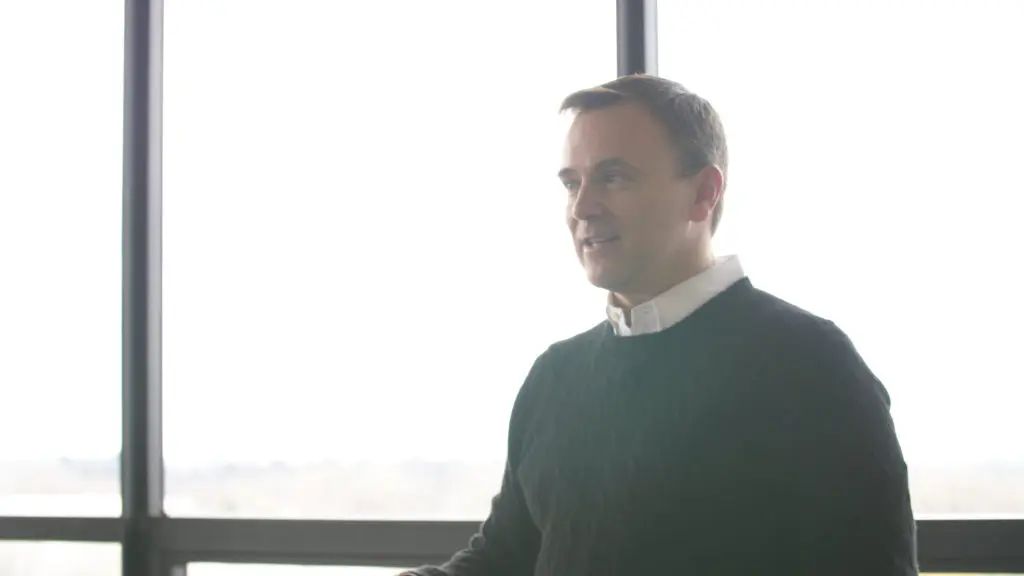 Callagy speaking to someone in his office