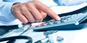 A provider calculating healthcare revenue declines due to COVID-19